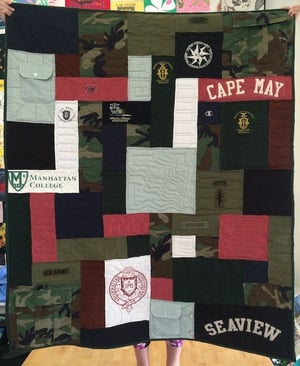 Military uniforms made into a quilt to celebrate a military career.