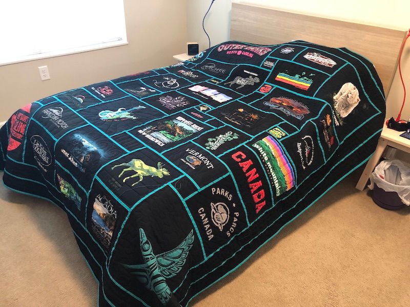 Travel T-shirt quilt on a bed